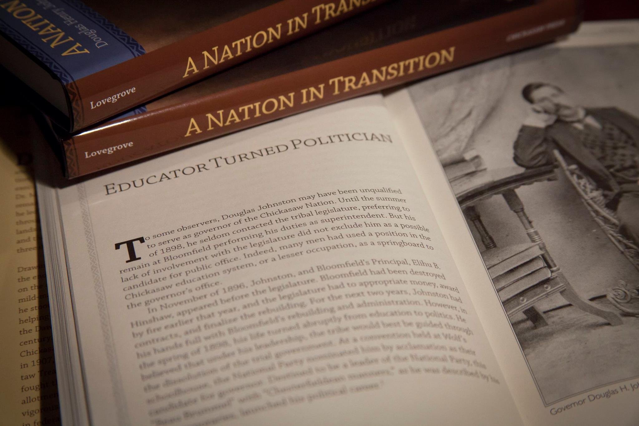 The book, "A Nation in Transition," open to the chapter "Educator turned Politician"