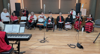 Chickasaw women gathered in a studio recording Choctaw hymns.